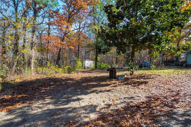 a backyard of a house with lots of green space
