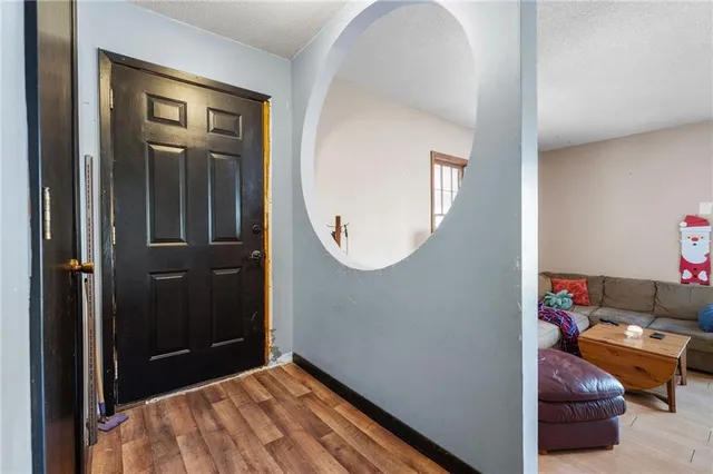 a living room with blue lights with furniture and toys