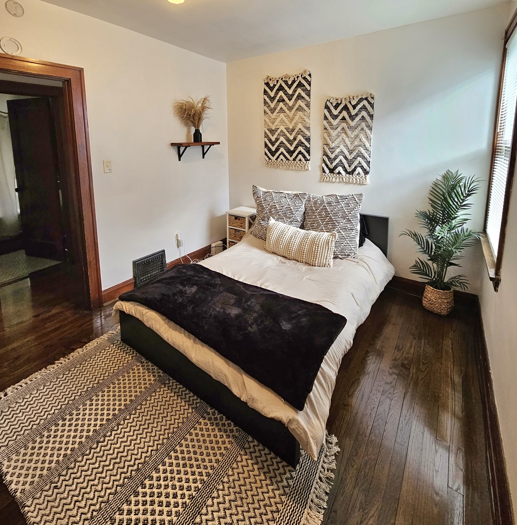 2446 Lewis Street, Unit 2 Blue Island, IL 60406 - Photo 6 of 18 a bedroom with a bed and a potted plant