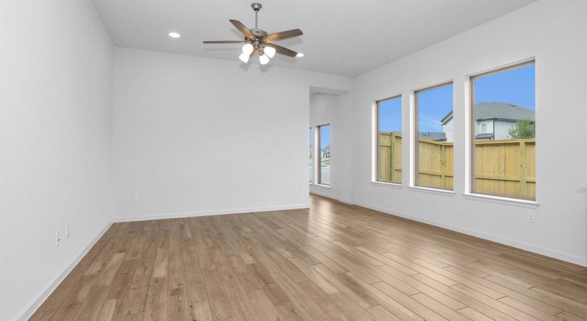 303 Eileen Drive Rosenberg, TX 77471 - Photo 11 of 17 wooden floor in an empty room with a window