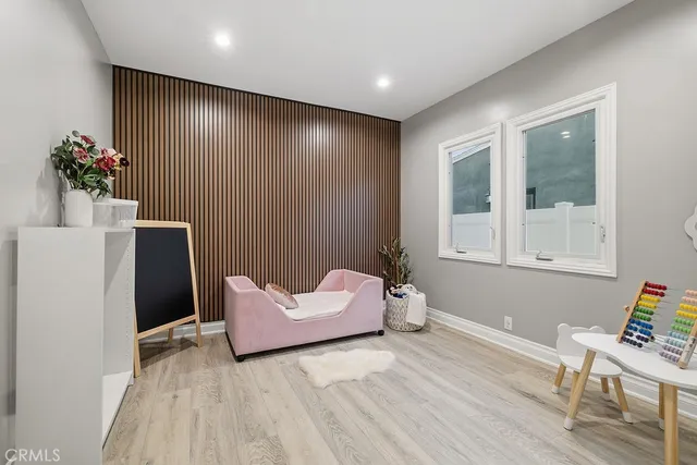 a spacious bedroom with a bed and a window