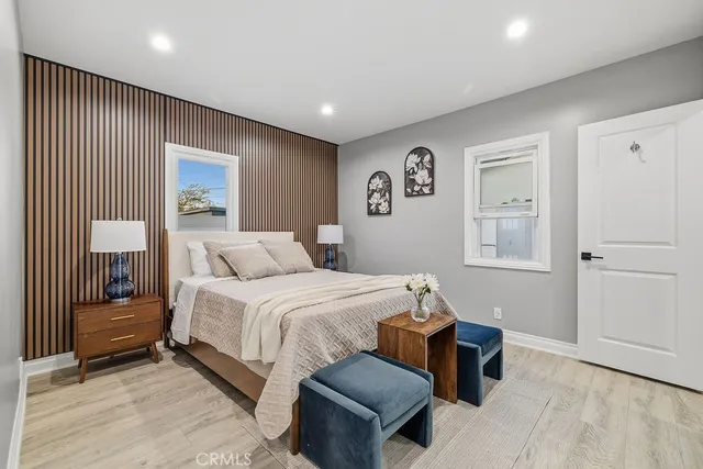 a spacious bedroom with a bed and a couch