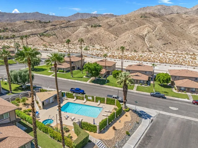 an aerial view of multiple house with yard