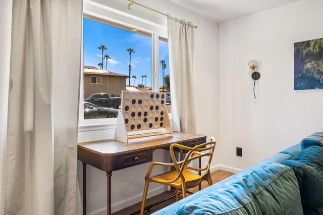 a living room with a bed and furniture