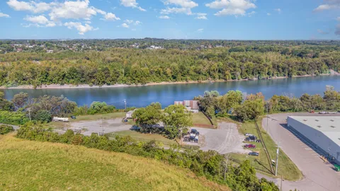 an aerial view of a houses with a lake view