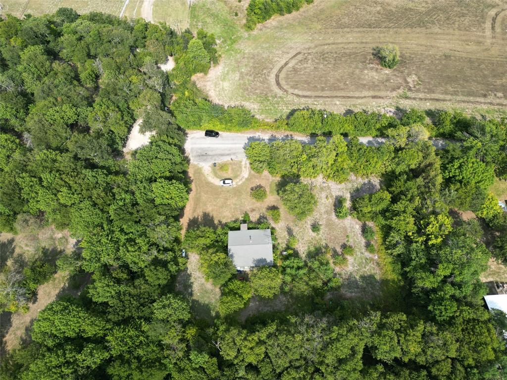 1214 Old Millwood Road Rockwall, TX 75087 - Photo 17 of 24 an aerial view of a house with a yard and large trees