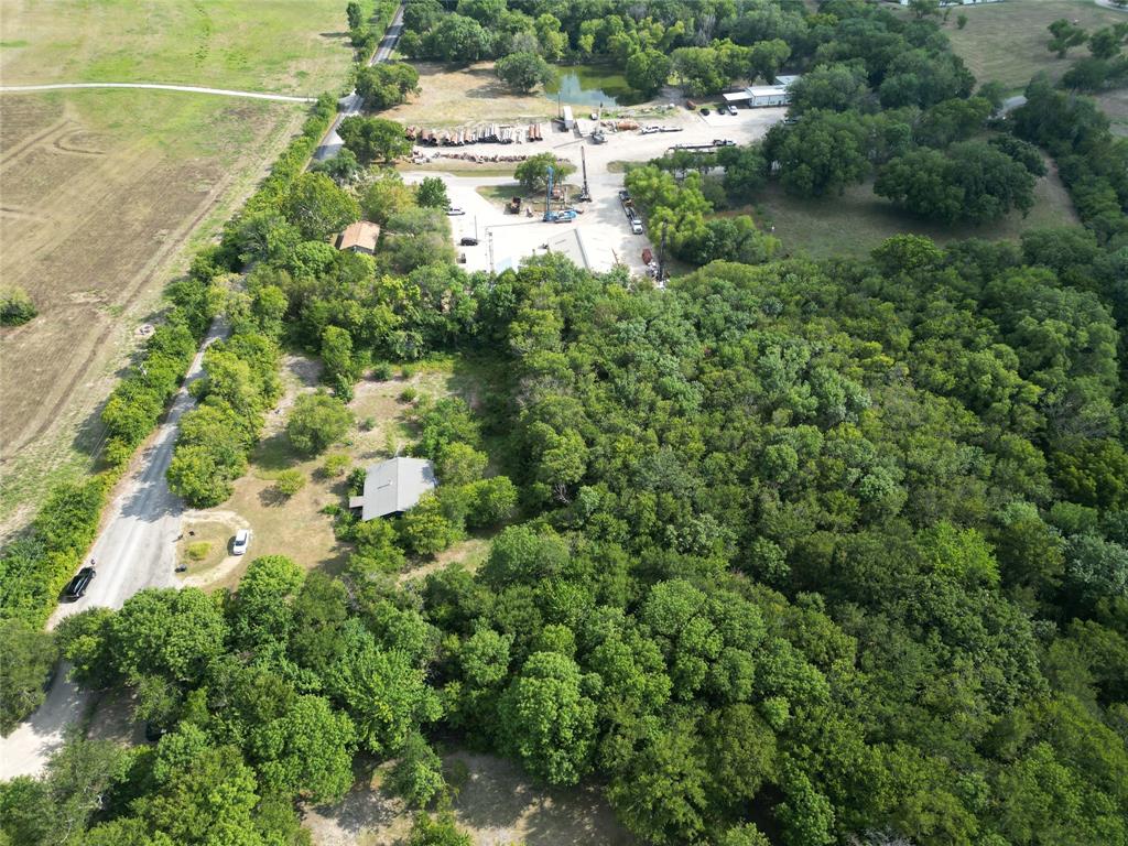 1214 Old Millwood Road Rockwall, TX 75087 - Photo 10 of 24 a view of a water pond with lots of trees