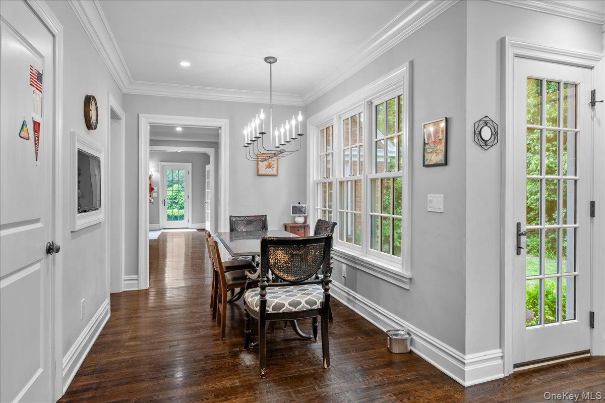 7 Harcourt Road Scarsdale, NY 10583 - Photo 7 of 34 a dining room with furniture a chandelier and wooden floor