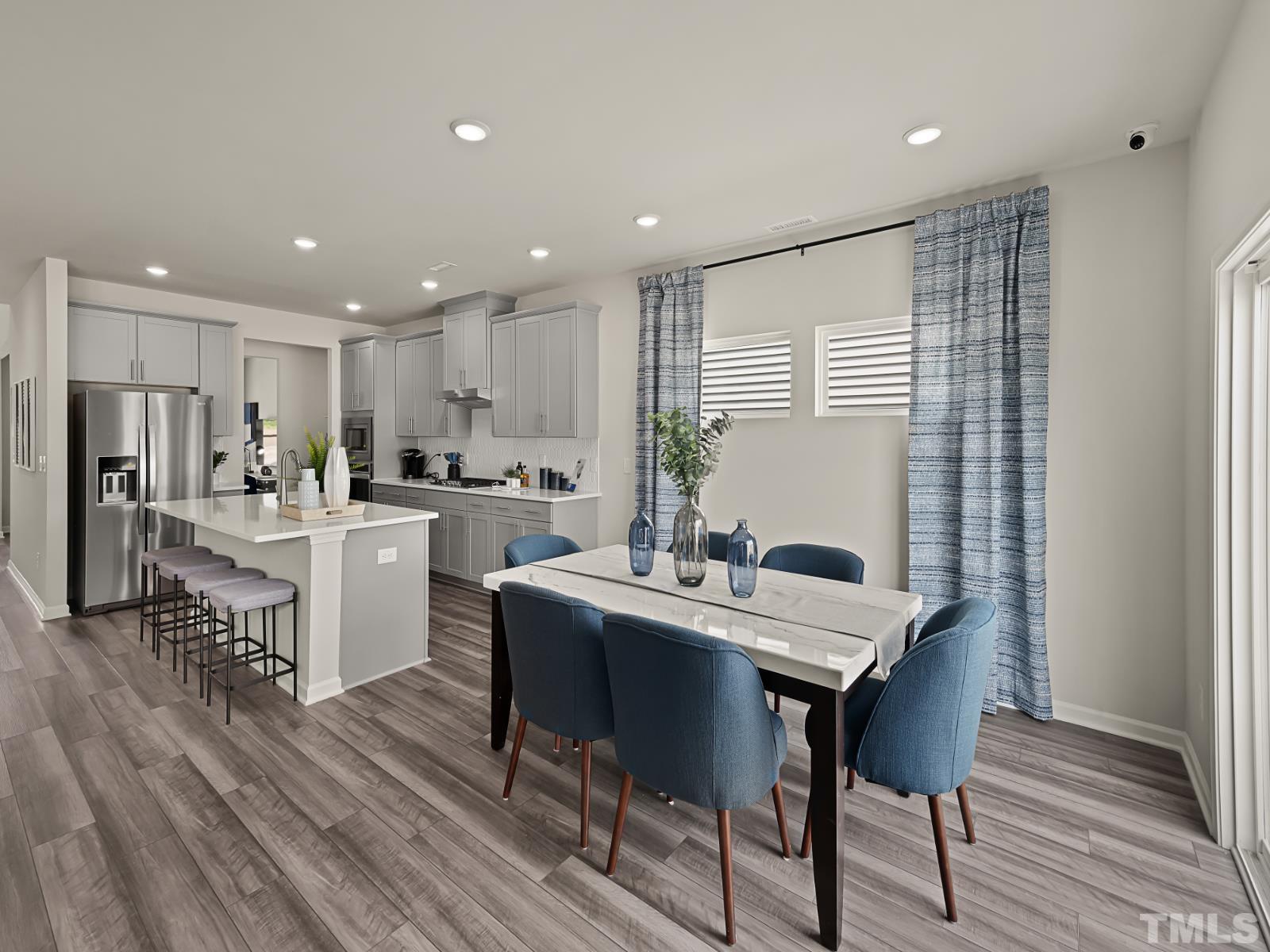 3013 Farndale Trace Durham, NC 27712 - Photo 5 of 14 a kitchen with a table and chairs in it