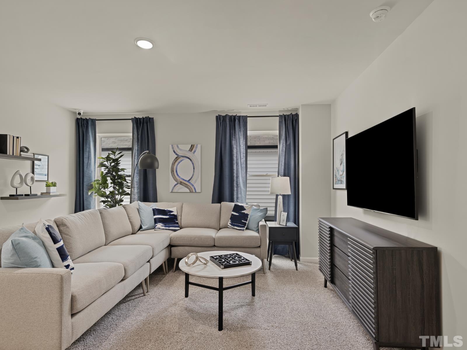 3013 Farndale Trace Durham, NC 27712 - Photo 7 of 14 a living room with furniture and a flat screen tv