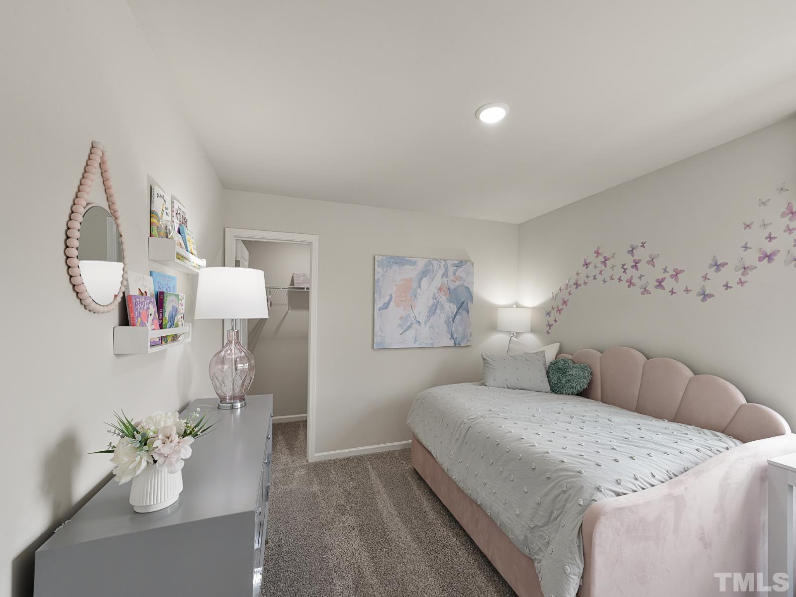 3013 Farndale Trace Durham, NC 27712 - Photo 10 of 14 a spacious bedroom with a bed and a chandelier