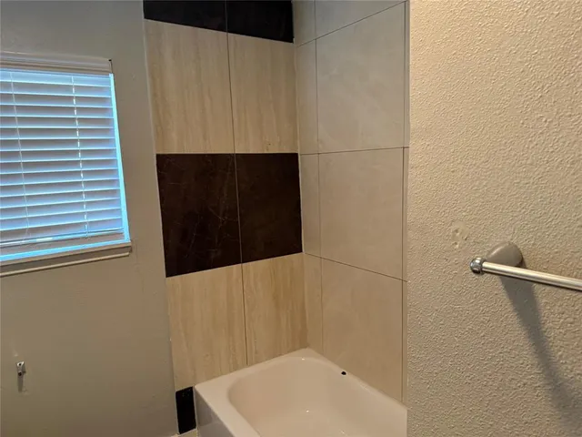 a bathroom with a sink and a shower