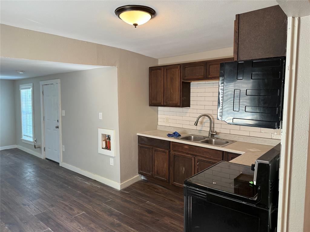2781 Locust Avenue Dallas, TX 75216 - Photo 5 of 15 a kitchen with sink cabinets and stainless steel appliances