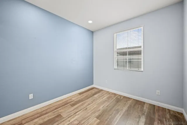 a bathroom with a sink a toilet and shower curtain