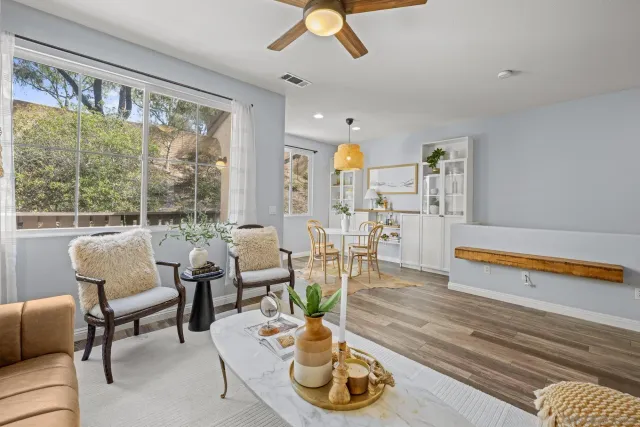 a living room with furniture and a large window