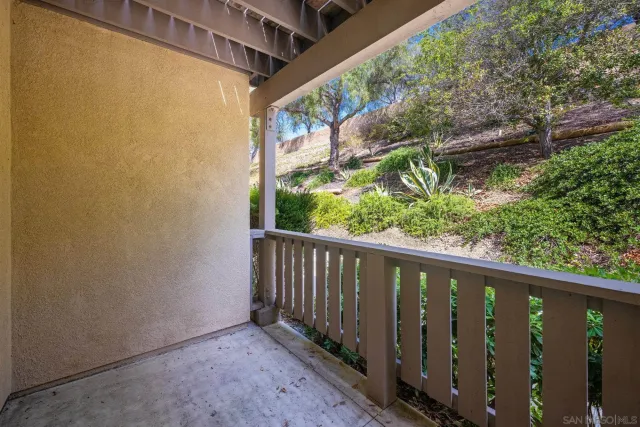 a view of a balcony with wooden floor