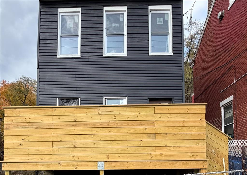 a view of a wooden door of the house