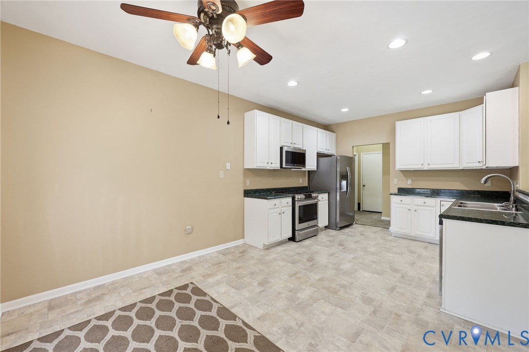 14719 Clover Ridge Lane Chesterfield, VA 23832 - Photo 10 of 36 Kitchen featuring white cabinetry, dark countertop