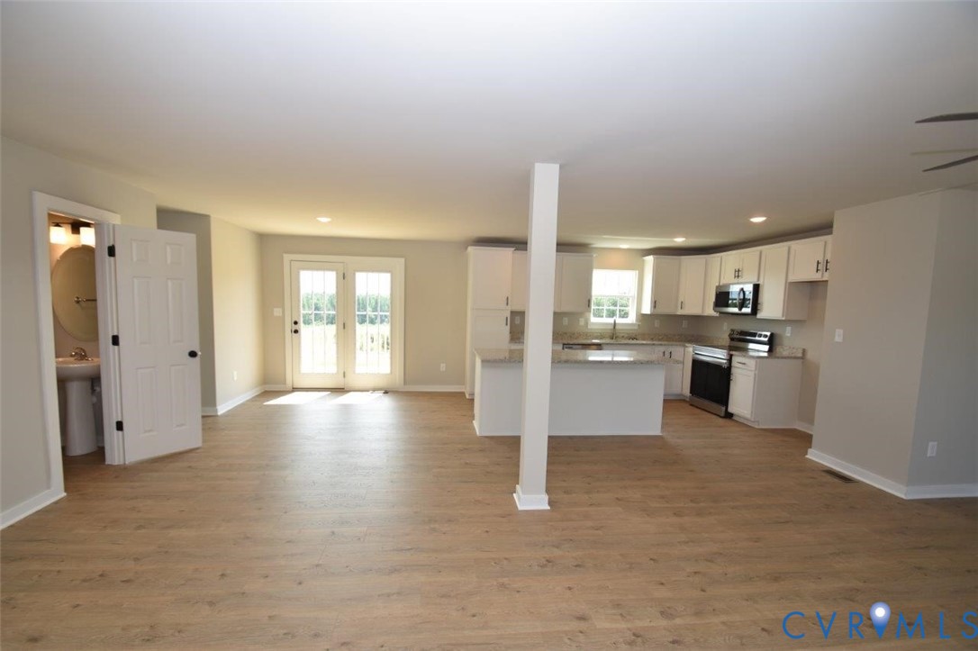 1088 Hanback Road Gordonsville, VA 22942 - Photo 26 of 26 a view of a kitchen with refrigerator and wooden floor