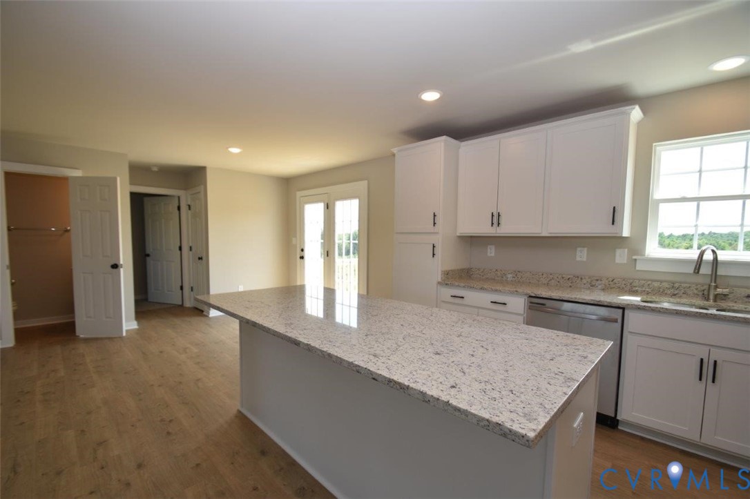 1088 Hanback Road Gordonsville, VA 22942 - Photo 22 of 26 a kitchen with granite countertop a sink stove and cabinets