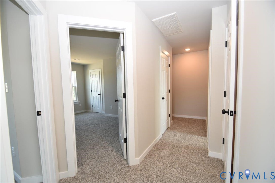 1088 Hanback Road Gordonsville, VA 22942 - Photo 7 of 26 a view of a hallway with three rooms