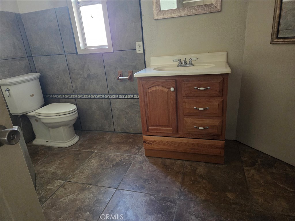 22899 Byron Road, Unit 41 Crestline, CA 92325 - Photo 2 of 10 a bathroom with a toilet and a sink