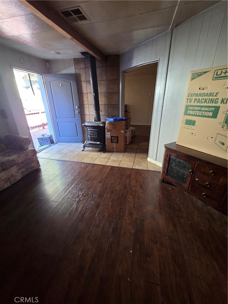 22899 Byron Road, Unit 41 Crestline, CA 92325 - Photo 6 of 10 a view of a livingroom with furniture a hardwood floor and a rug