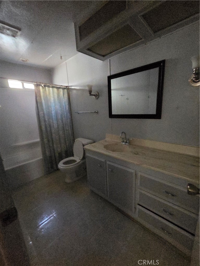 22899 Byron Road, Unit 41 Crestline, CA 92325 - Photo 10 of 10 a bathroom with a toilet sink and mirror