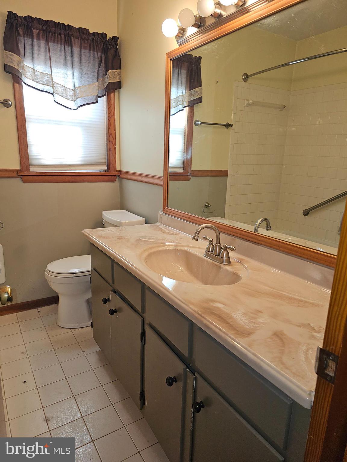 615 Villa Avenue, Unit B Front Royal, VA 22630 - Photo 14 of 21 a bathroom with a sink a toilet and mirror