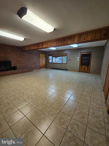 a room with a washing machine and storage