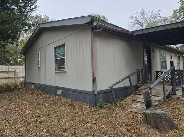 a house with a tree in the background