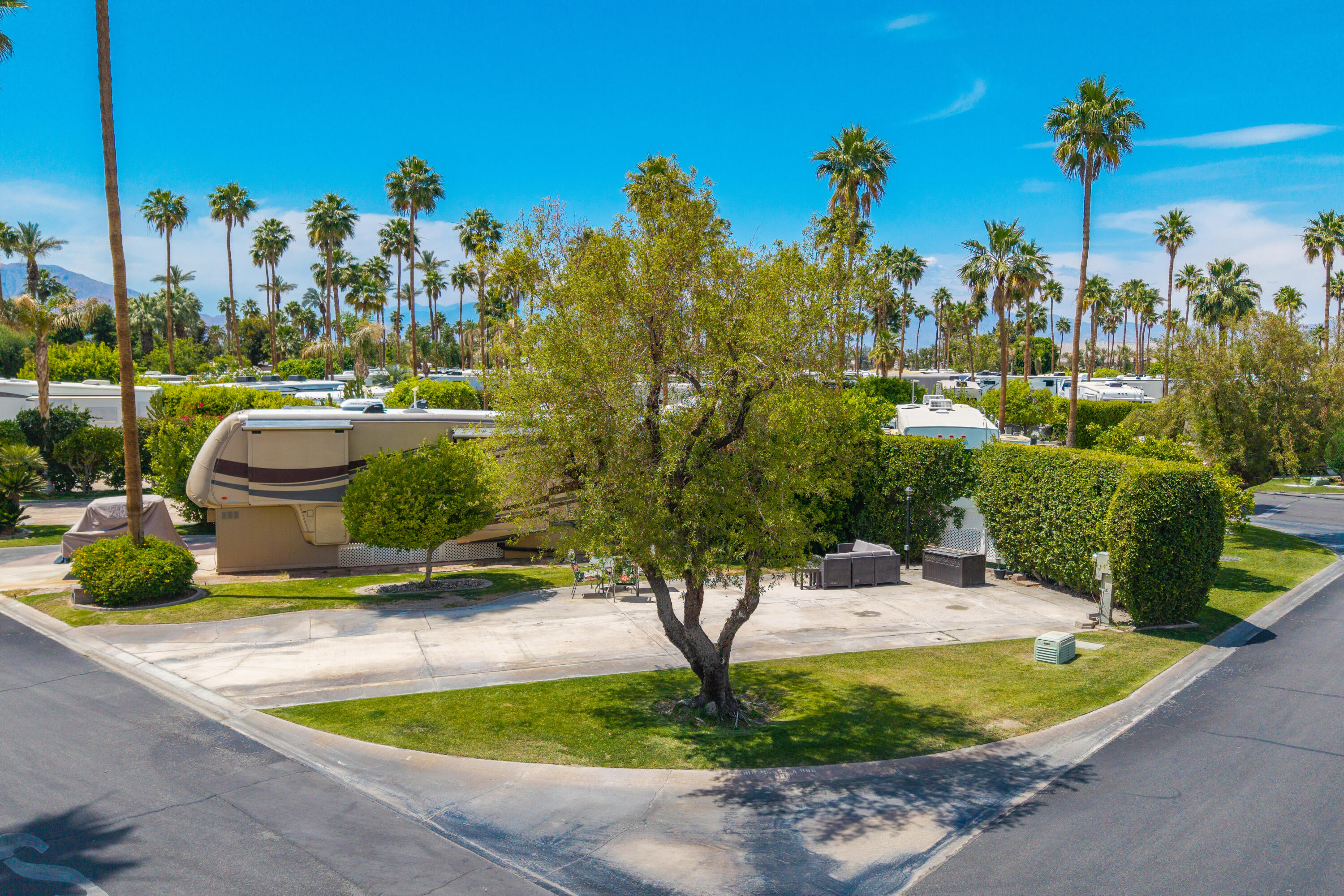 69411 Ramon Road, Unit 359 Cathedral City, CA 92234 - Photo 3 of 51 a view of a swimming pool with a yard