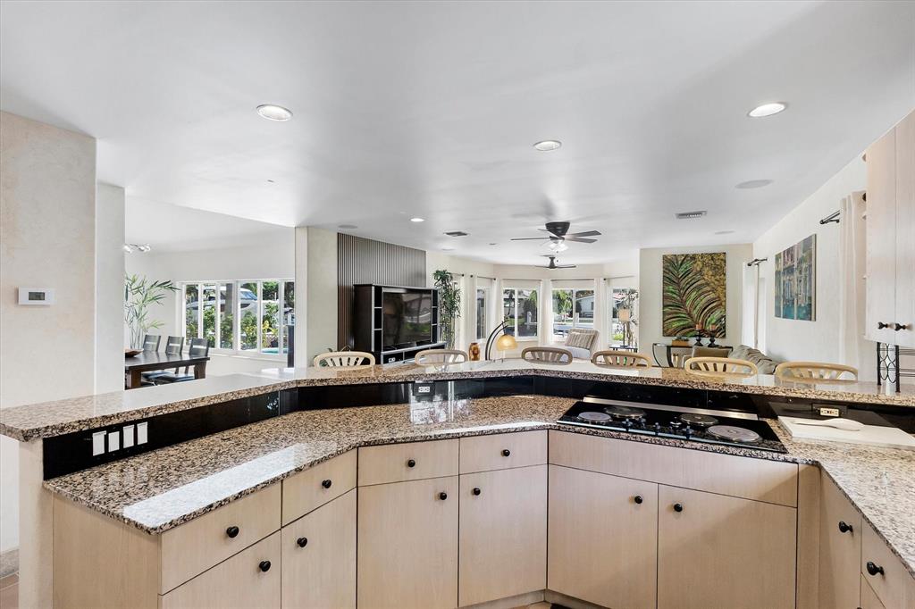 2484 Southeast 12th Street Pompano Beach, FL 33062 - Photo 12 of 61 a kitchen with a sink stove and cabinets