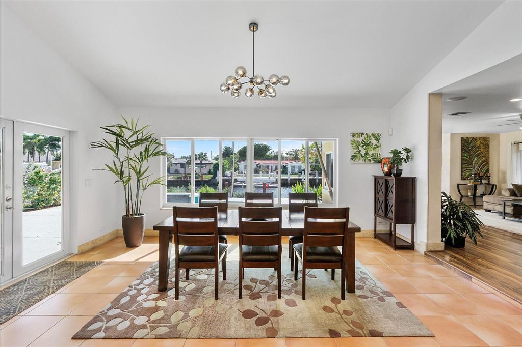 2484 Southeast 12th Street Pompano Beach, FL 33062 - Photo 16 of 61 a view of a dining room with furniture window and wooden floor