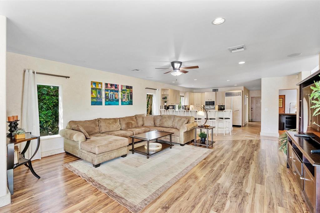 2484 Southeast 12th Street Pompano Beach, FL 33062 - Photo 17 of 61 a living room with furniture and a flat screen tv