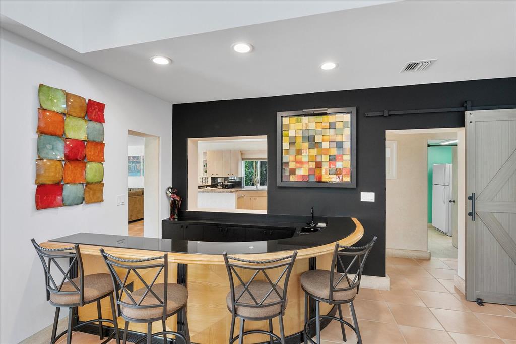 2484 Southeast 12th Street Pompano Beach, FL 33062 - Photo 19 of 61 a dining room with furniture and window