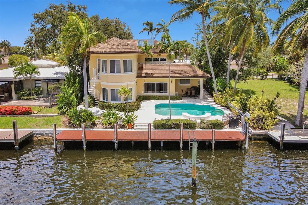 2484 Southeast 12th Street Pompano Beach, FL 33062 - Photo 2 of 61 a view of house with swimming pool and outdoor seating