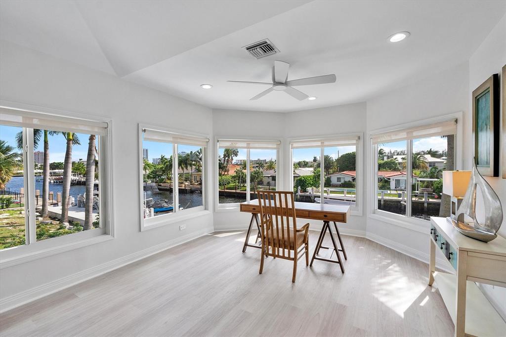2484 Southeast 12th Street Pompano Beach, FL 33062 - Photo 24 of 61 a view of a dining room with furniture large windows and wooden floor