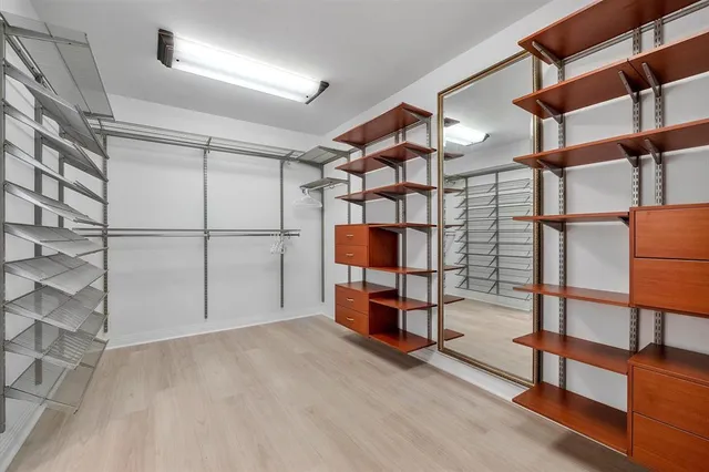 a bathroom with a shower sink and mirror