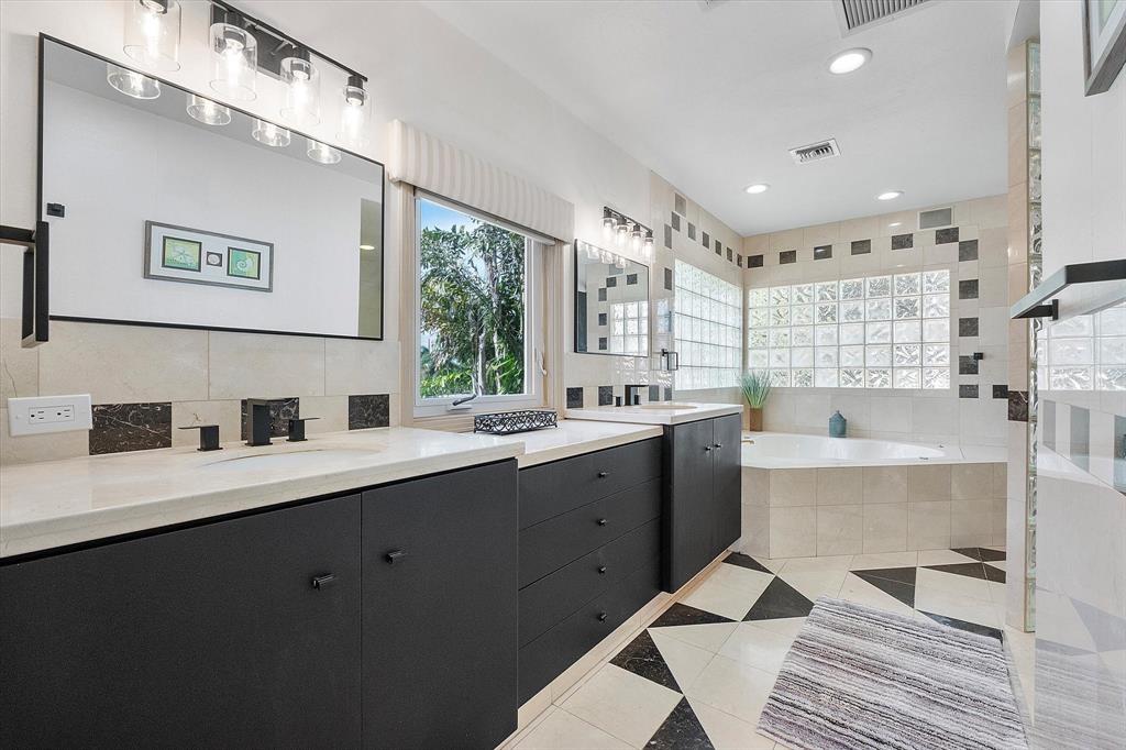 2484 Southeast 12th Street Pompano Beach, FL 33062 - Photo 29 of 61 a kitchen with a sink appliances and a window