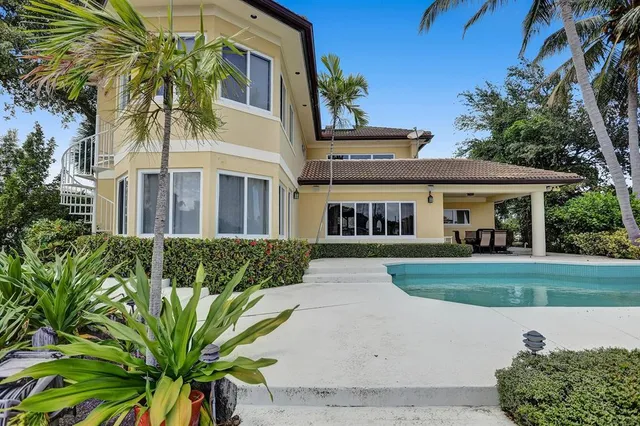 a view of a swimming pool with a patio
