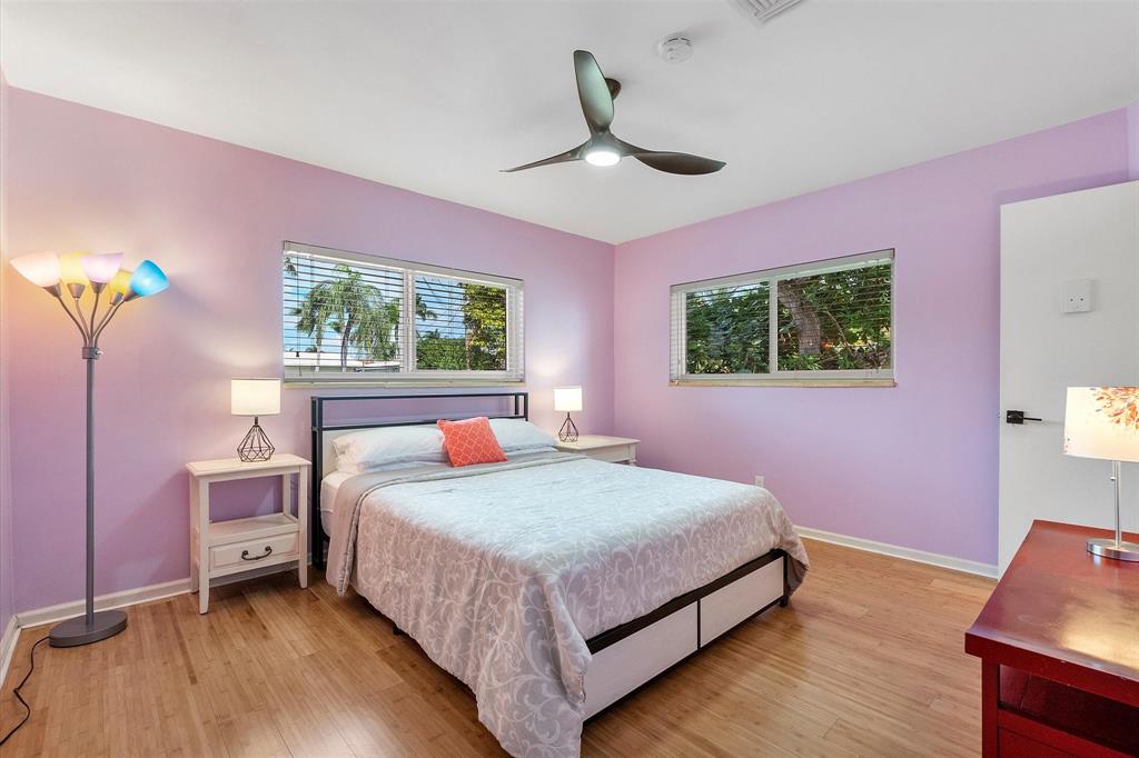 2484 Southeast 12th Street Pompano Beach, FL 33062 - Photo 37 of 61 a bedroom with a bed and a window