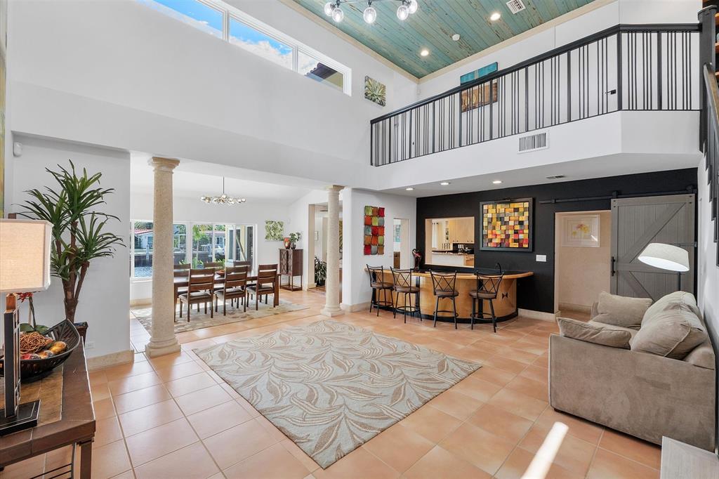2484 Southeast 12th Street Pompano Beach, FL 33062 - Photo 39 of 61 a living room with furniture and a large window