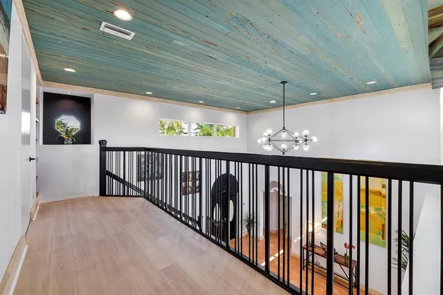 an aerial view of a house with a lake view