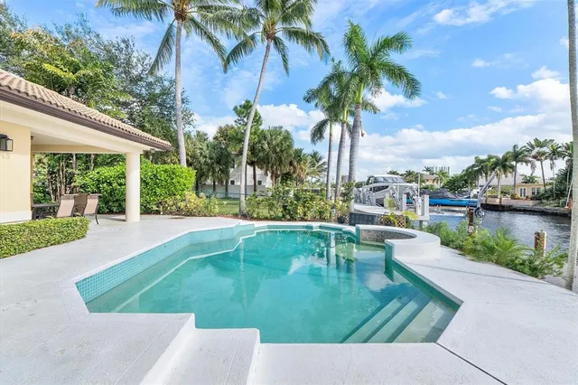 a porch with swimming pool in front of it
