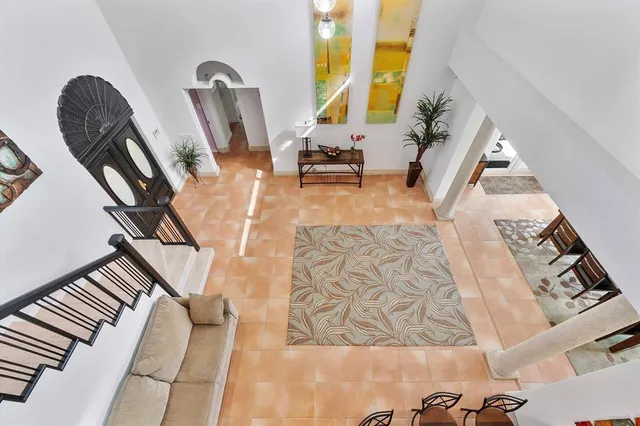 an aerial view of a residential houses with outdoor space