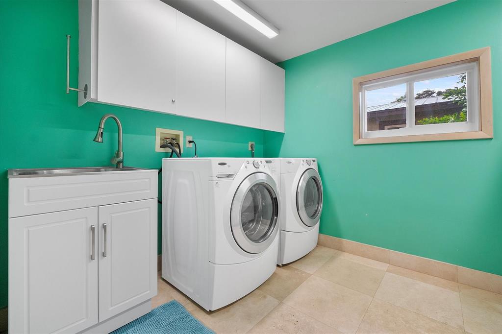 2484 Southeast 12th Street Pompano Beach, FL 33062 - Photo 44 of 61 a utility room with dryer and washer