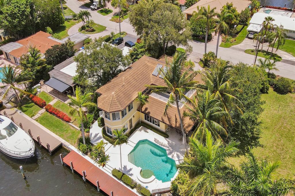 2484 Southeast 12th Street Pompano Beach, FL 33062 - Photo 56 of 61 an aerial view of a house with a yard and swimming pool