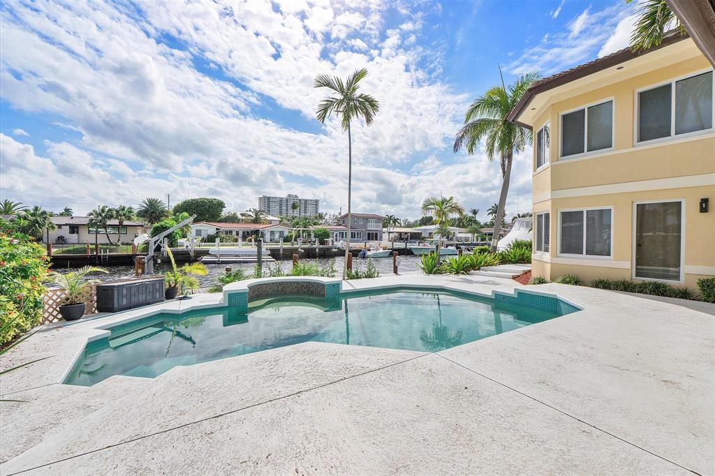 2484 Southeast 12th Street Pompano Beach, FL 33062 - Photo 59 of 61 a view of a swimming pool with a patio