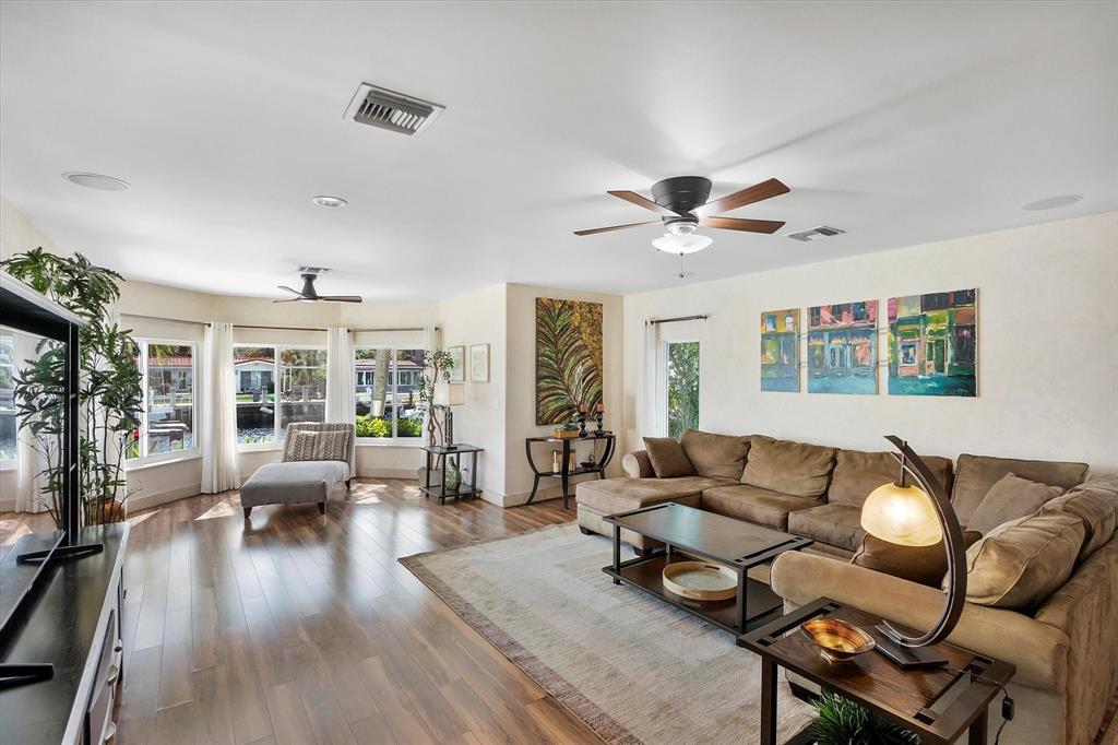 2484 Southeast 12th Street Pompano Beach, FL 33062 - Photo 9 of 61 a living room with furniture and wooden floor